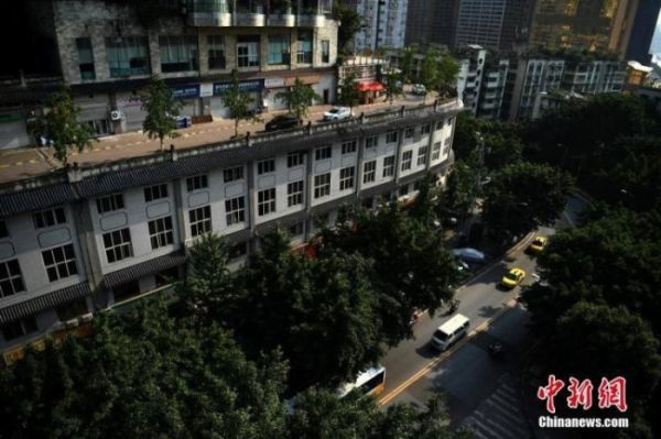 На первый взгляд, это обычный пятиэтажный дом в Китае